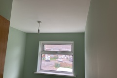 Bedroom completed.  Room re-plaster: Plaster directly over artex ceiling. Plaster all walls, window reveals. Painting and decorating undertaken and completed.