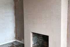Fireplace: Re-build and re-plaster.