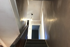 Stairwell walls and ceiling application of new Plaster.